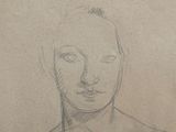 un dessin du visage d'une femme sur un morceau de papier