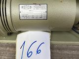 an old sewing machine with a note attached to it ' s side