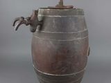 an old metal barrel with a handle on a gray background
