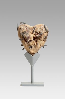 a close up of a sculpture of a heart on a stand