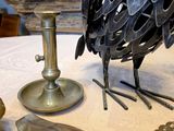 a metal bird that is sitting on a table