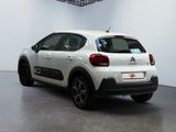 the rear of a white citrole parked in a white room