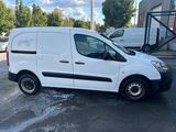 the white van is parked in the parking lot