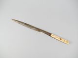 an image of a knife on a white surface