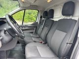 the interior of a van with the front seats folded down