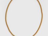 un collier en or orné d'une pierre orange et d'une perle