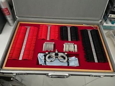 a suitcase that has many different types of hair brushes in it