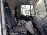 a white van with a black seat in the back of it