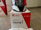 a helmet sitting on top of a box on the floor