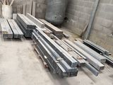 many pieces of wood sitting on the floor in a room