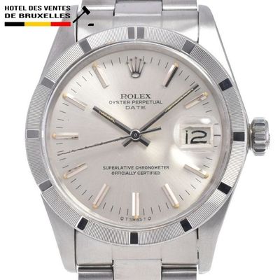 une photo d'une montre Rolex en acier inoxydable avec un cadran blanc