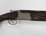 a shotgun with a gun on it sitting on a table