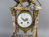 a statue of a lion on top of a clock