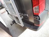 a close up of the rear end of a truck with the door open