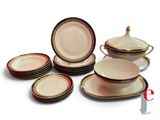 many different types of plates and bowls on the table