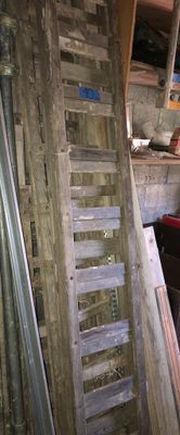 a ladder that is leaning against a wall in a room