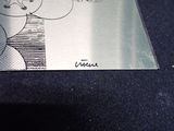 a piece of metal that has a drawing on it