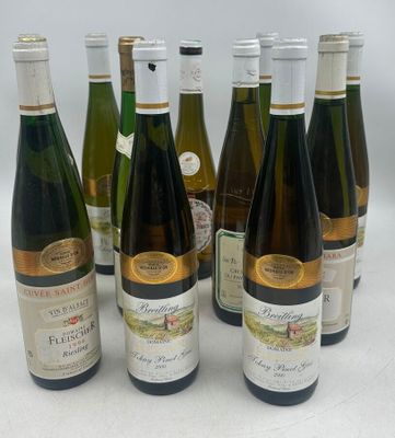 several bottles of wine are lined up in a row on a table