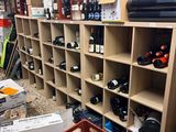 a room filled with lots of wine bottles and boxes