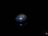 an image of a sphere in the dark with a galaxy in the background