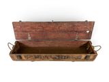 an old wooden box with a handle on it