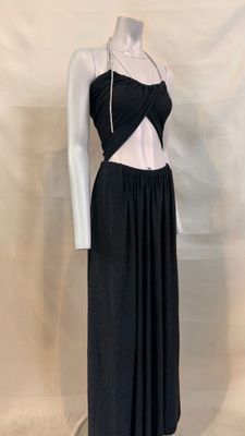 the mannequin is wearing a black dress with a white top and black skirt
