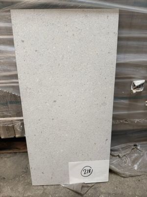 white marble slab with a sticker on the side of it