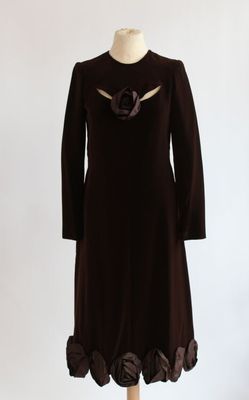 brown dress on a mannequin stand with a white background