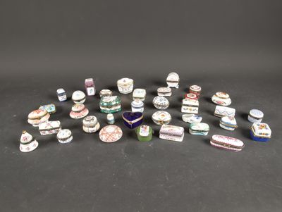 a group of small porcelain objects on a black surface