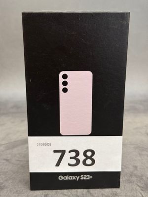 une boîte sur laquelle est posé un téléphone rose, posée sur une table