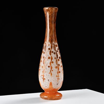 a glass vase that is sitting on a table