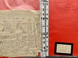 a red folder with a piece of paper on it