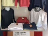 a lot of clothing on display in a store