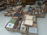 many boxes of books stacked on top of each other
