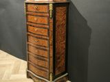 an antique chest of drawers in the style of louis ii