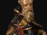 an image of a statue of a man with a book in his hand