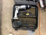 a tool kit in a case on the ground