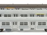 two trains that are sitting side by side on the tracks