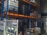 a large warehouse with a lot of pallets on the shelves