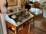 a kitchen with a table and chairs and pictures on the wall