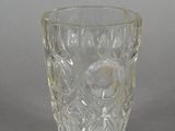 a glass cup that is sitting on a table