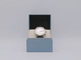 an image of a watch in a box on a white surface