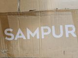 a cardboard box with the word sampur written on it
