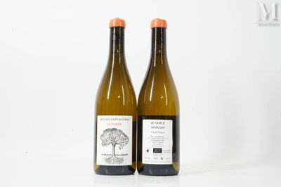 two bottles of wine sitting next to each other on a white surface