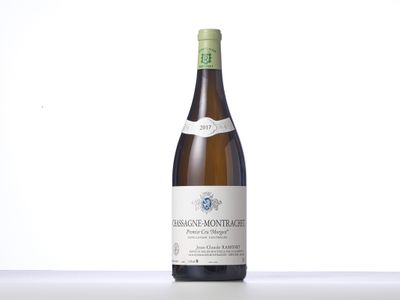 the bottle of white wine is sitting on the table