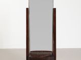 an image of a mirror on a stand in a room