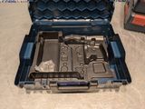a tool box with tools inside of it on the floor