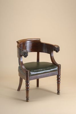 an image of a chair with a leather seat on a beige background