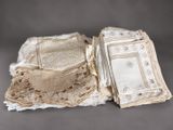 several pieces of cloth and lace are laid out on a table