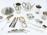 many different types of silverware on the table